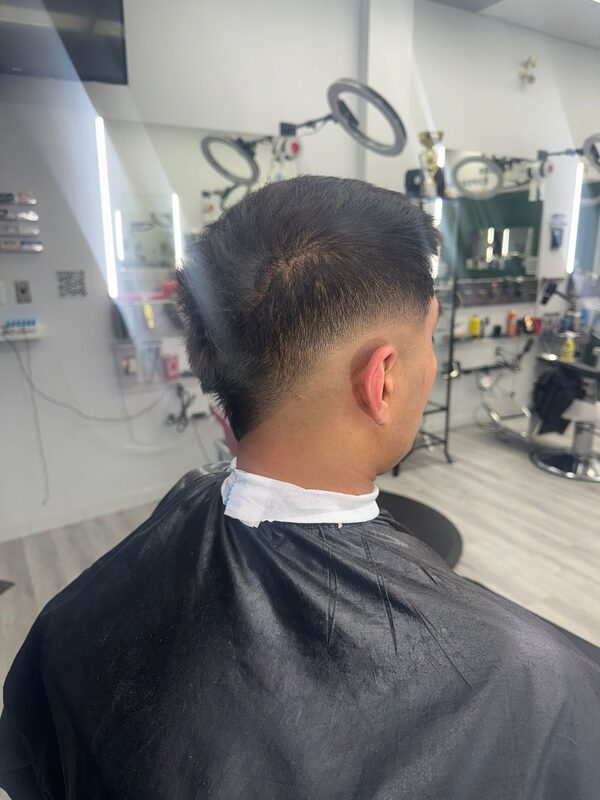 Back of the head showing a short textured crop with a clean taper fade