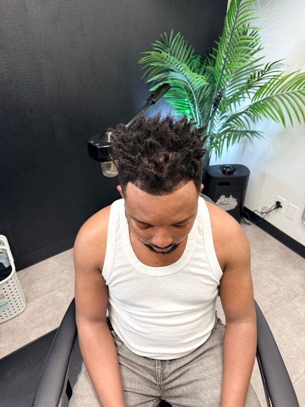 Overhead view of short twisted sponge curls with a low fade